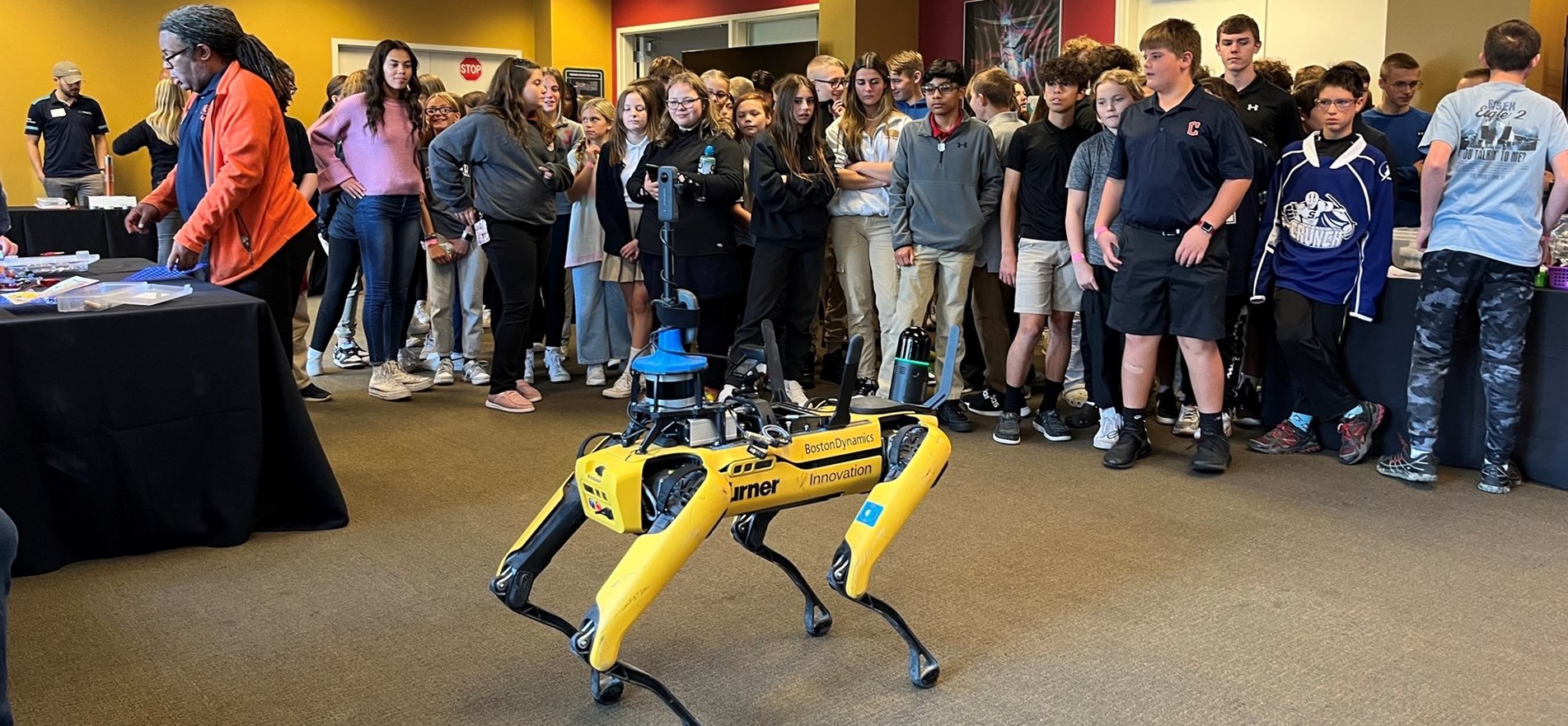JMS students inspect robotic guard device during Meta Day at COSI in Columbus, Ohio.