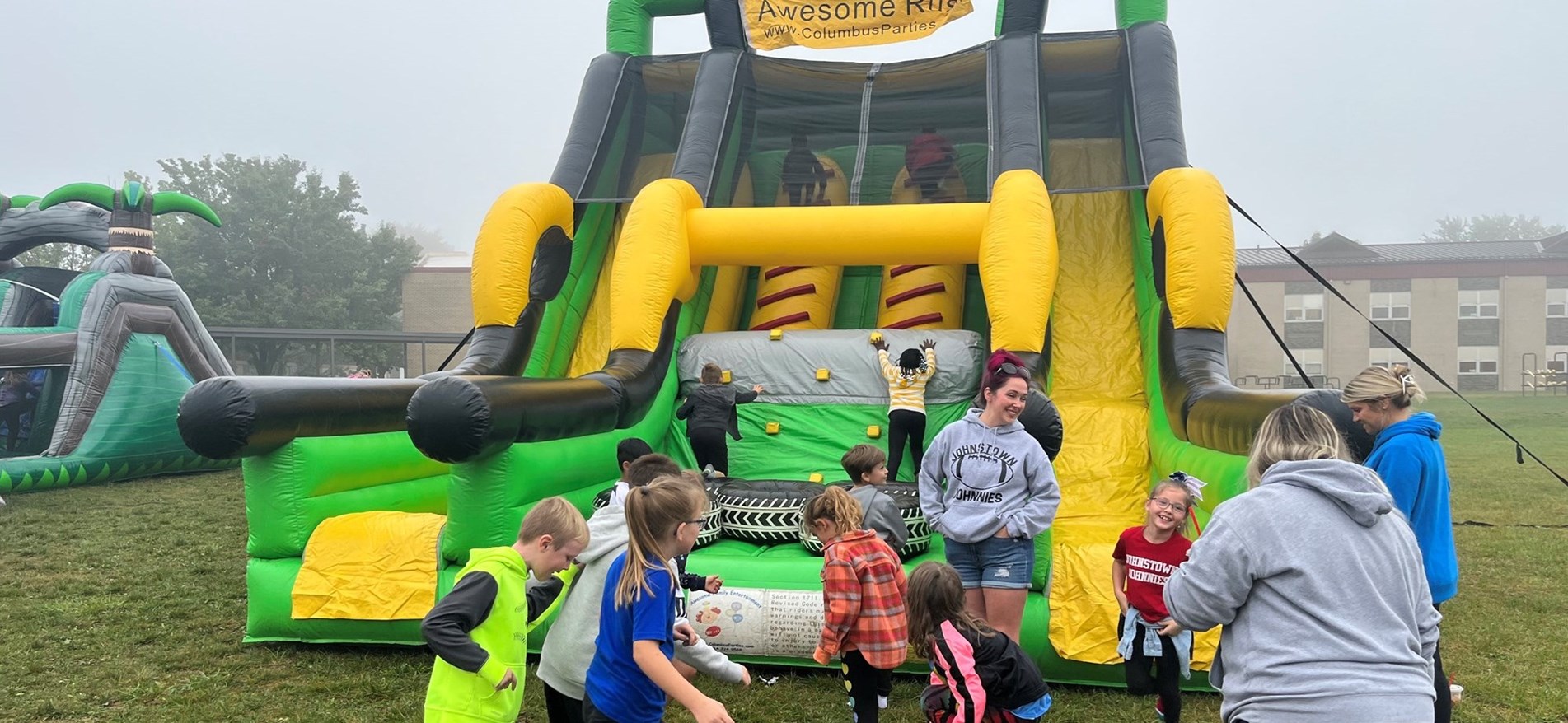 Students and PTO members enjoy playing on inflatable attractions during Walk-A-Thon event.