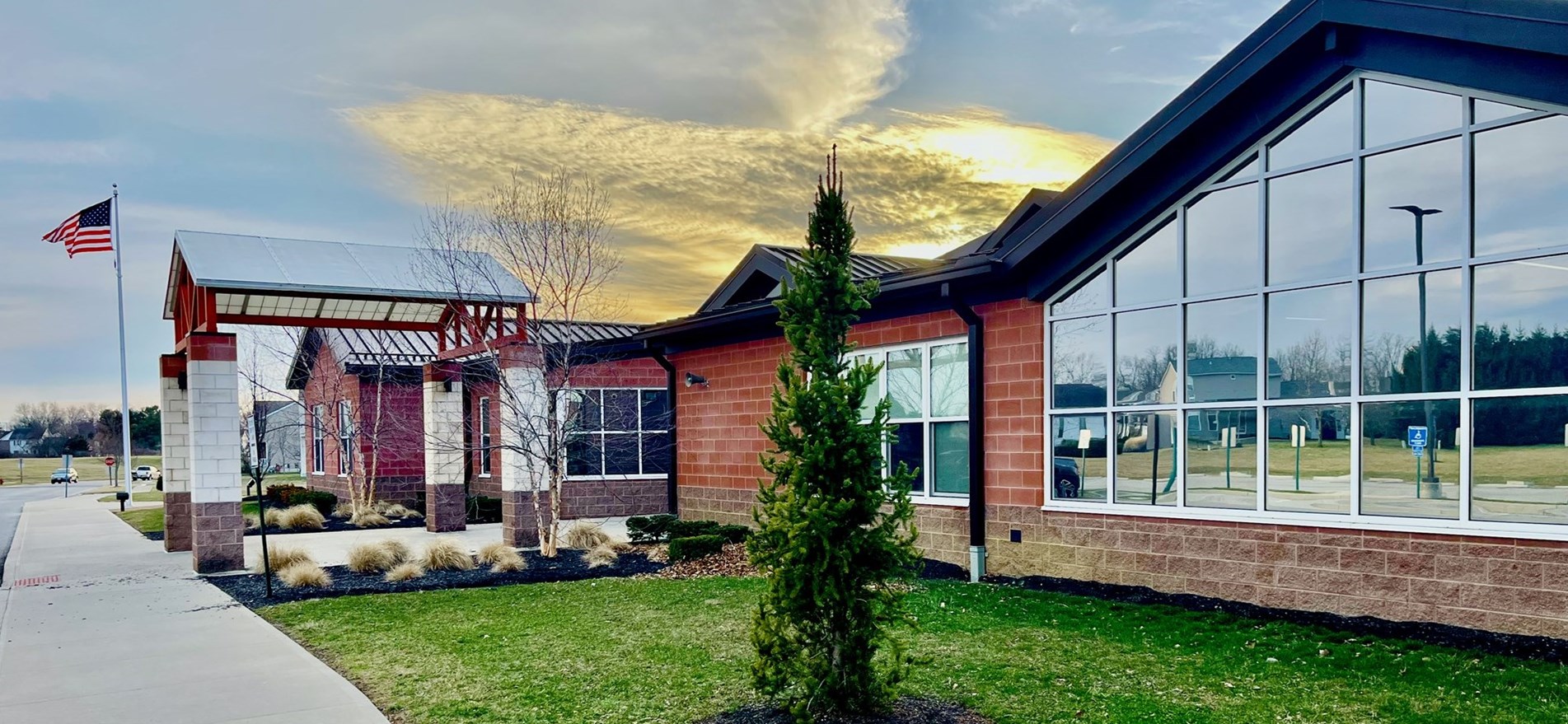 Exterior photograph of the front of Johnstown Elementary School at sunset.