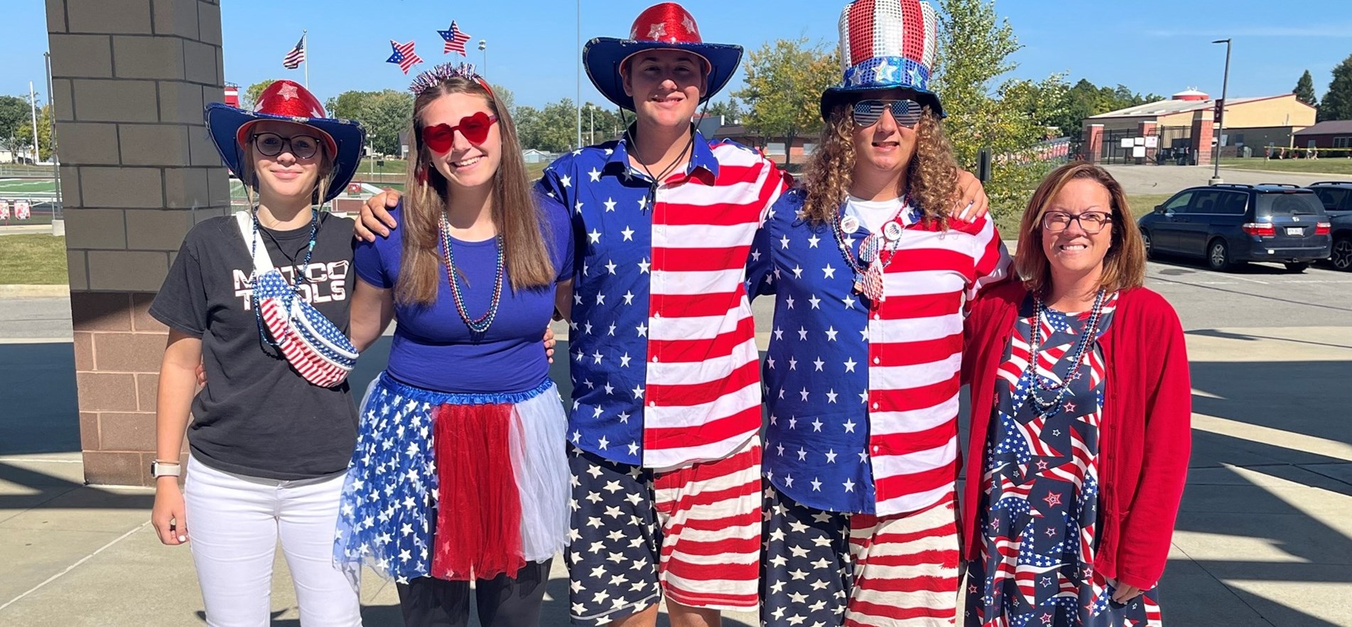 A quintet of staff and student body members wear patriotic clothing for special spirit day