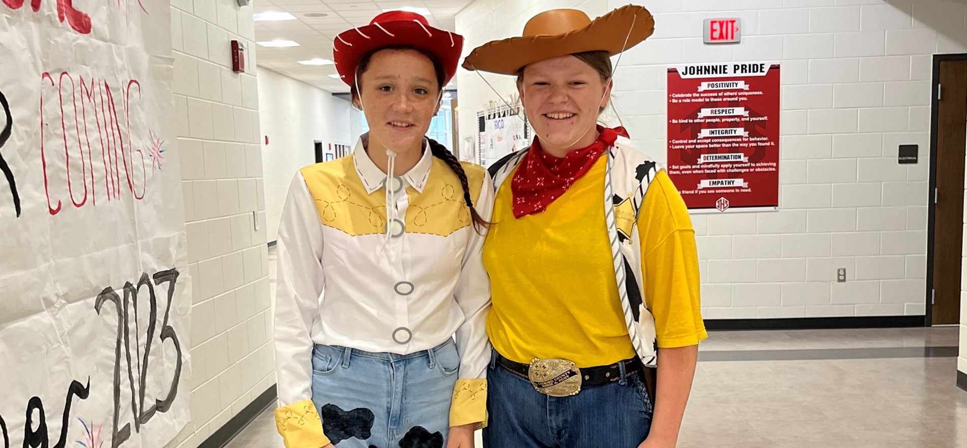 Students standing in high school hallway dressed as Toy Story characters for Iconic Duo spirit week theme day