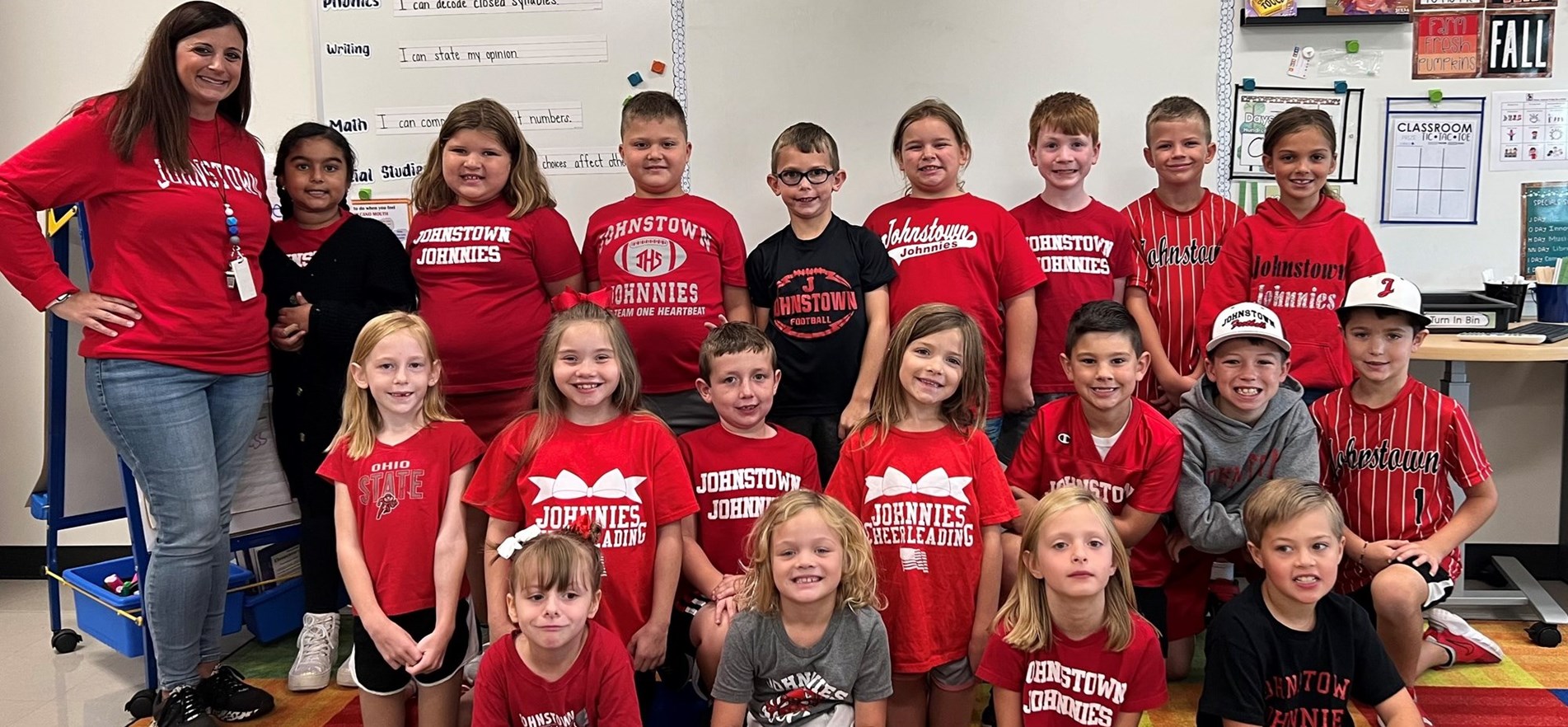 Elementary students and teacher wear Johnnie wear