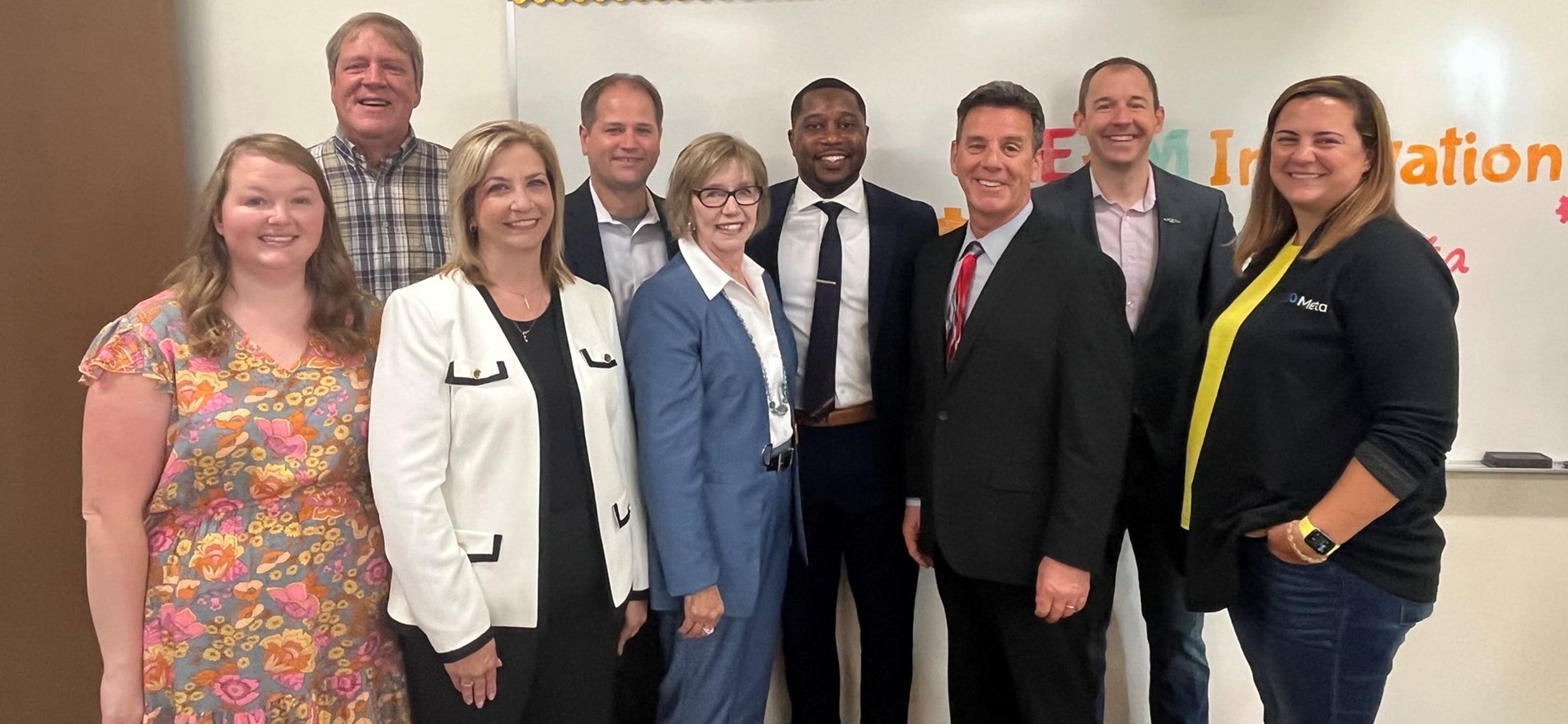 School Board members, administrators and META representatives gather for group photo at STEAM Lab opening