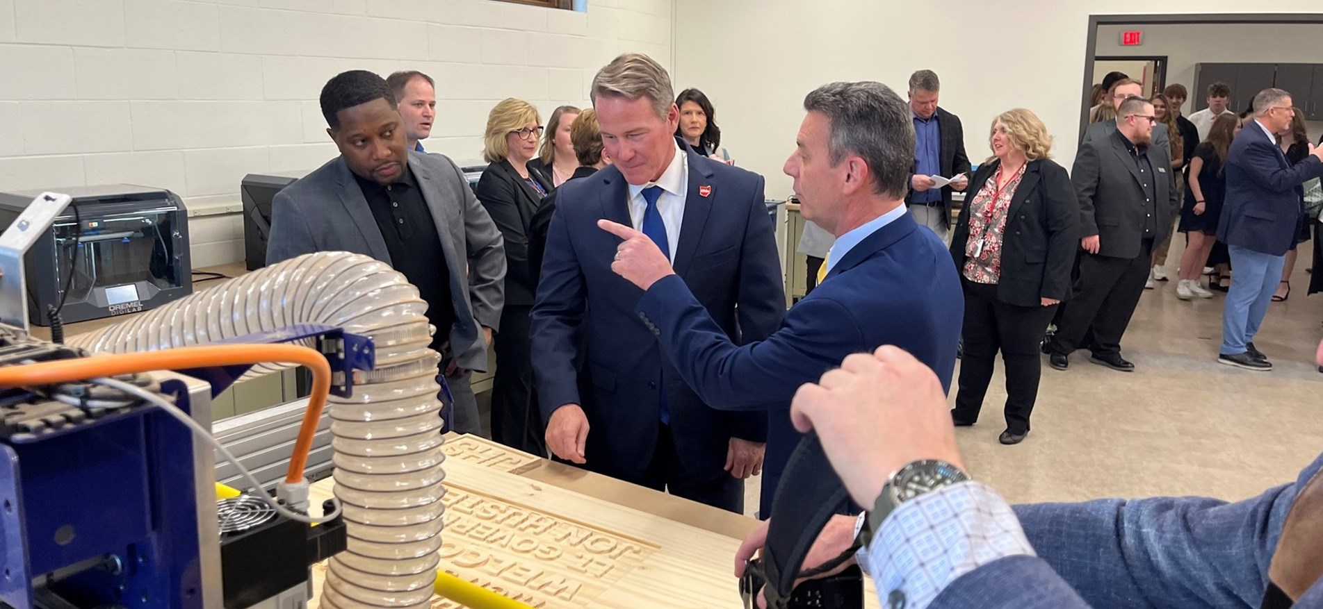 Meta representative, Lt. Governor Jon Husted and other officials examine new STEAM materials.