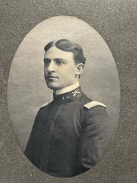 Head and Shoulders photograph of Perry Miles in uniform with hat, 3/4 view